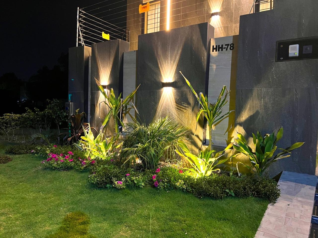 Night garden and house number plate